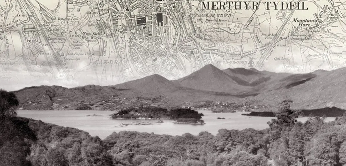 Black and white photo of a lake, with an old map of Merthyr Tyfil fading into the sky