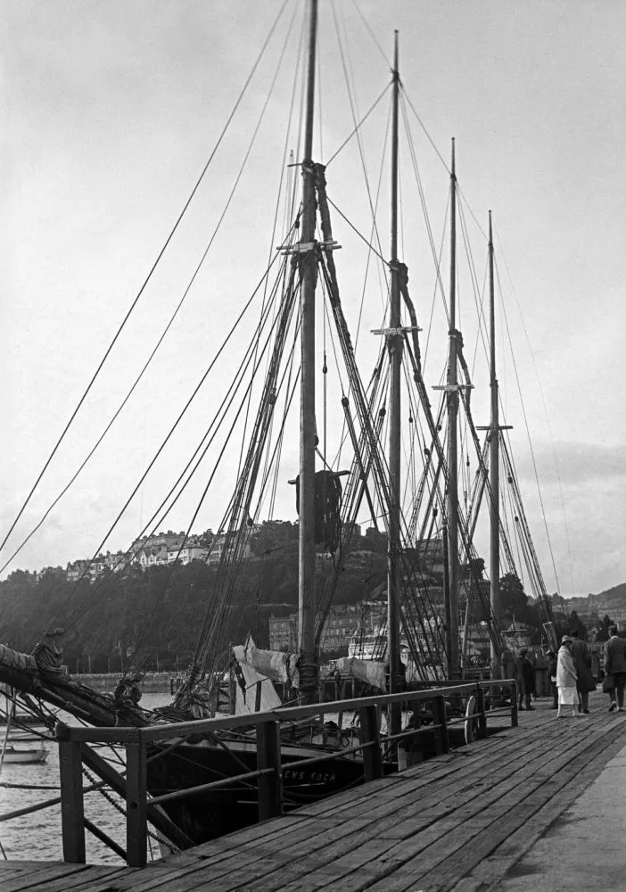 A photograph of a docked ship in a port