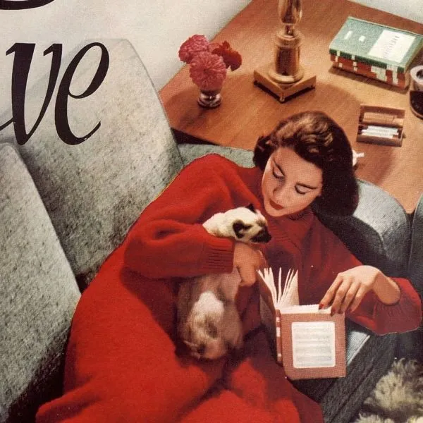 Illustration of a woman reading in the front cover of Britannia and Eve from 4 December 1956